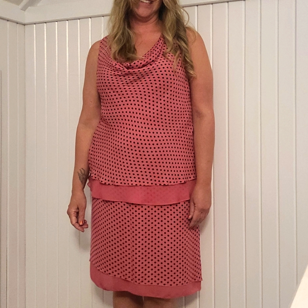 Emma pink and black matching cowel neck top and skirt.